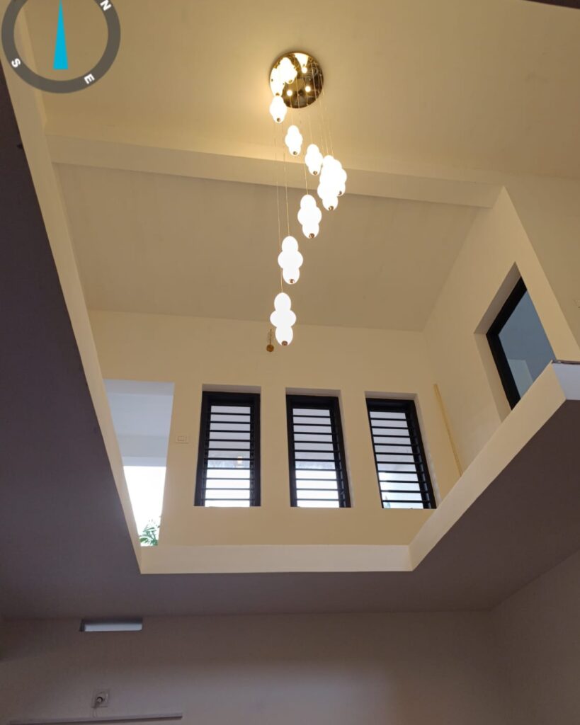 Modern pendant light with a long tail design, enhancing interior aesthetics.